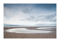 Crescent shaped paterns of water in the Sand