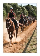 Different stable of jockeys returning after the gallop