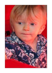 Jason sitting in his red car