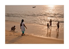 Playing on the Beach at Sunset