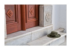 Hat on a Church Doorstep Megalochori Village