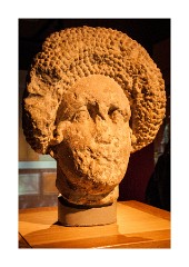 Bath 06  Head of a Lady This head probably decorated the tomb of a wealththy Lady.  Her hairstyle was fashionable in Rome in the later 1st Century