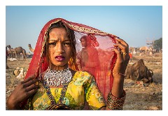 Pushkar 40  Pushkar Camel Fair -  young girl trying to get money for being photographed
