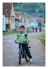 Copsa Mare 26  Main street showing local church and the fortified church in the distance