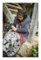 Viscri 43  The sleepy ticket keeper at the church and museum