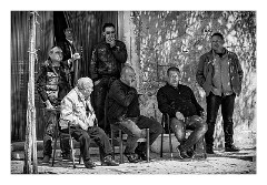 Puglia Monopoli Area 01  Men Watching the World go by on May Day Monopoli