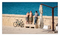 Puglia Lecce Area 026  Men taking in the Sun - Otranto