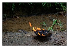 Galle 25  Burning incense for good luck outside the shop doors