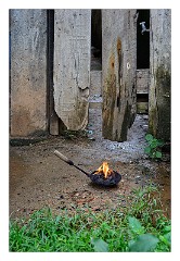 Galle 26  Burning incense for good luck outside the shop doors