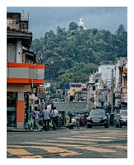 Kandy 14  Streets of Kandy with the Buddha above the trees