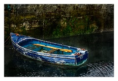 Scalpay 03  Boat tied alongside theCretetree Concret Ship from WW1