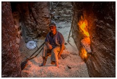 Marrakech 09  Man keeping the fire going for the hot water at the baths