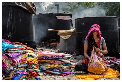 Agra 14  Worker with the many sorts of clothing been recycled