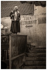 11 Leh and its Valley  Old Woman coming down the Steps