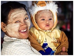 Bagan 01  Woman and Child with the Traditional Myanmar Thanakha  on their Faces in Nyaung  U Market