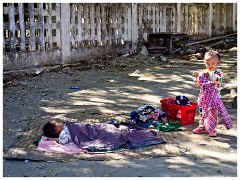 Mandalay 05  Children Sleeping and Playing while their Mothers Work on the Stalls
