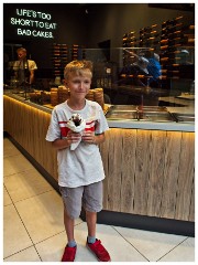 Family in Krakow 14  Jason in the Chimney Cake Bakery