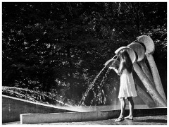 Krakow 005 Planty Park 05  People cool their Hands and Children Play in the Water Sculptures in the park