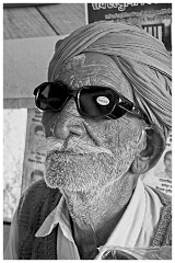 India Jaisalmer 69  In a street Cafe - Why has he a Label on his Glasses?