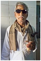 India Jaisalmer 75  Waiting with his Drink to be Checked with Number 129 Label and Dark Glasses before Leaving