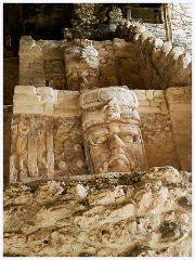 036 Dzibanche and Kohunlich  Temple of the Masks  This is an Early Classic Pyramid built in 500 AD with a central staircase decorated by large stucco masks. The pyramid is thought to be the oldest excavated structure in Kohunlich.
